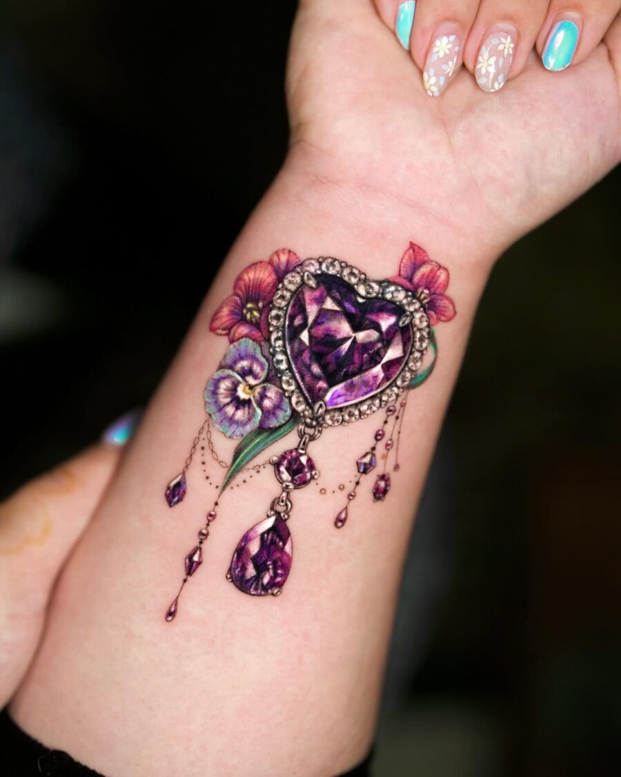 Beautiful heart tattoo with floral accents Tattoo on skin