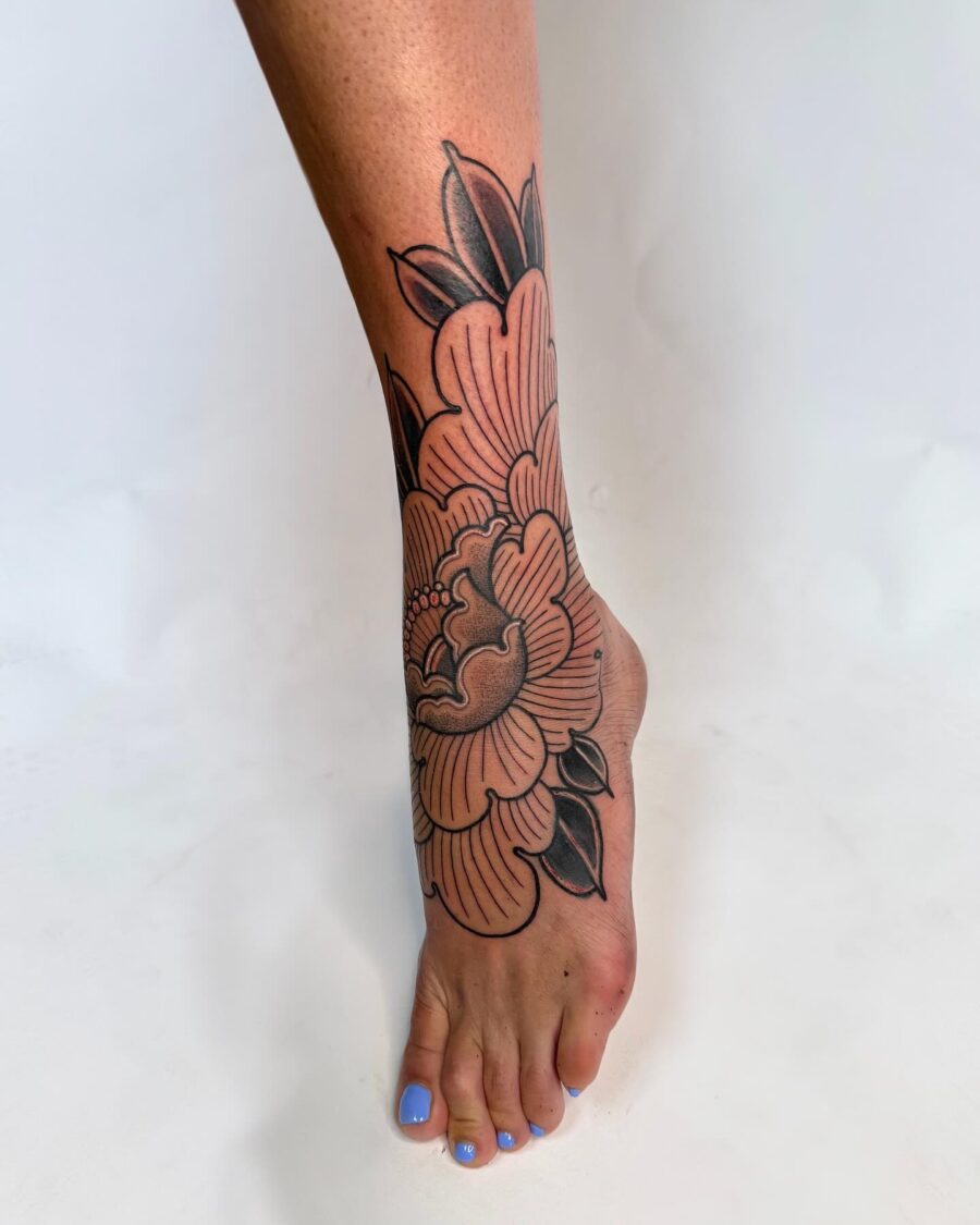 Elegant floral cover-up tattoo on the leg Tattoo on skin