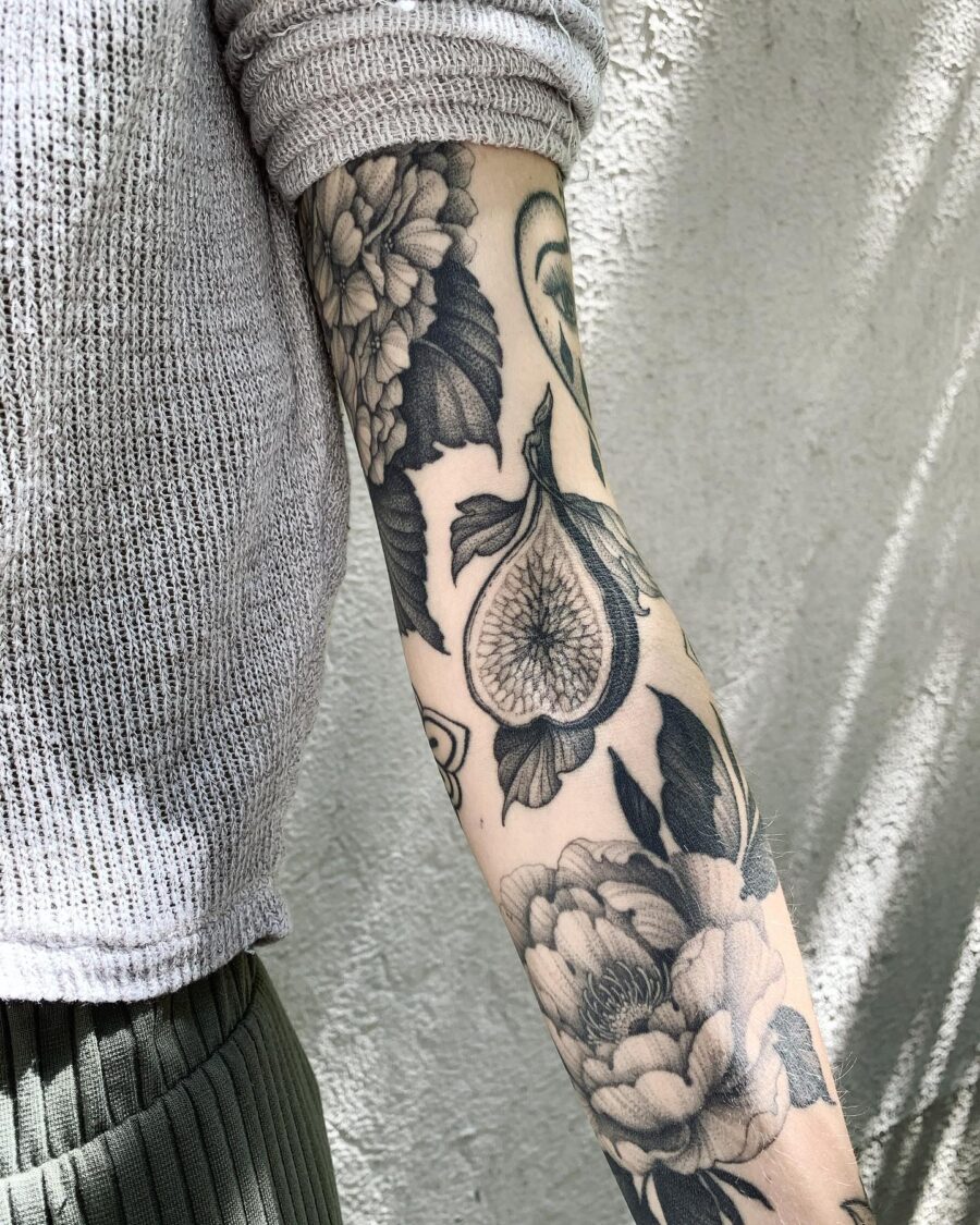 Intricate floral cover-up tattoo on arm Tattoo on skin