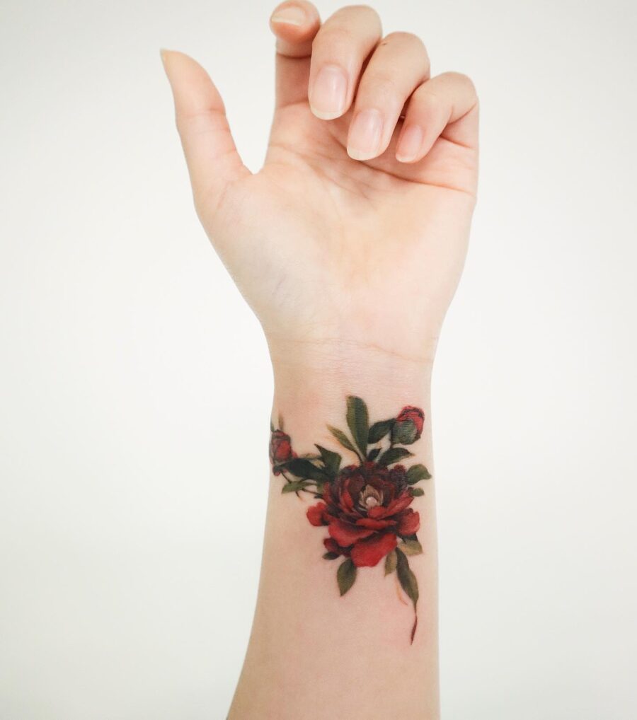 Vibrant floral wrist tattoo with intricate details Tattoo on skin