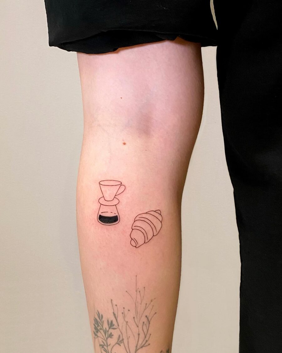 Charming croissant and coffee tattoo design Tattoo on skin