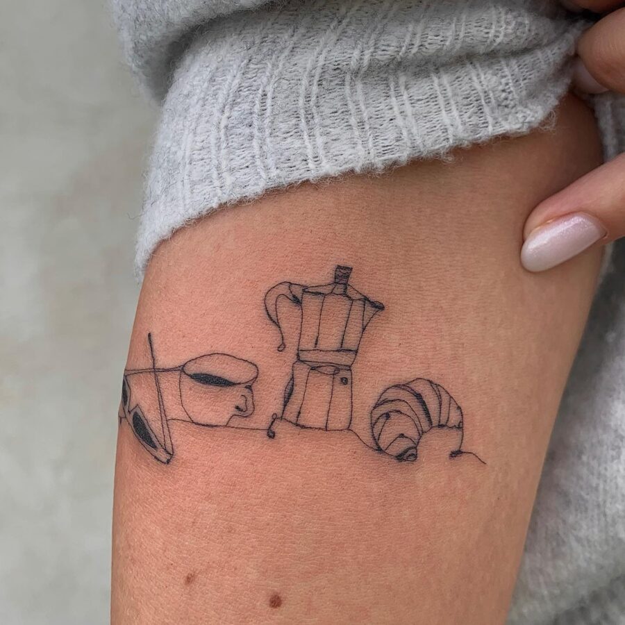 Charming croissant-inspired tattoo design on skin Tattoo on skin