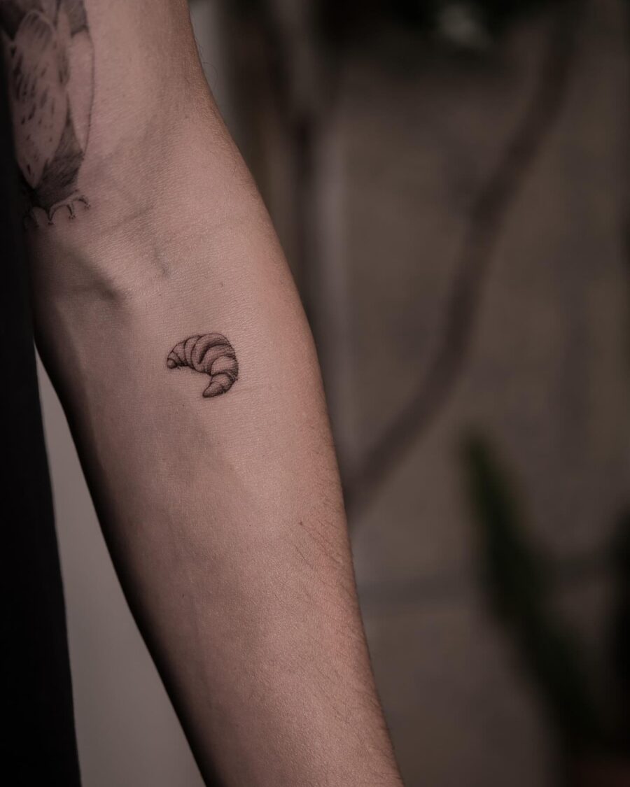Charming Croissant Tattoo on the Forearm Tattoo on skin