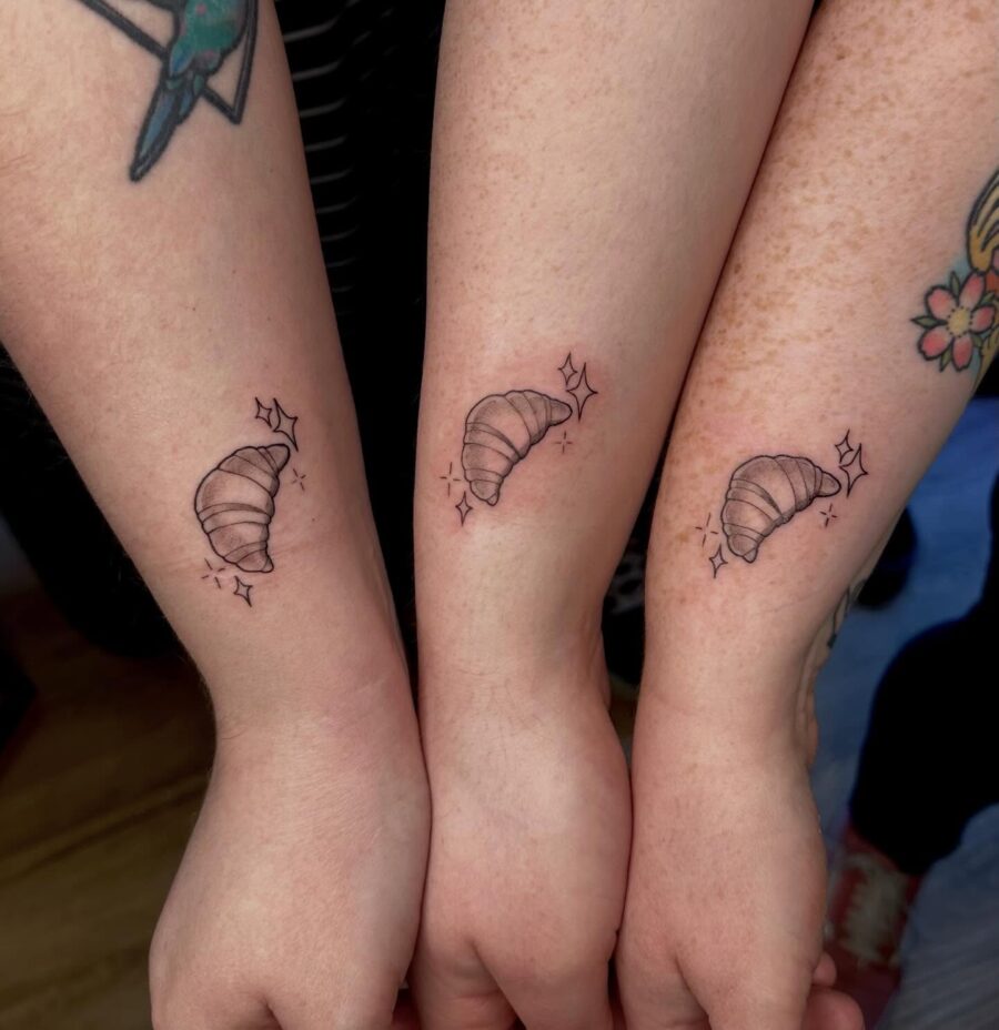 Charming minimalist croissant tattoo trio Tattoo on skin