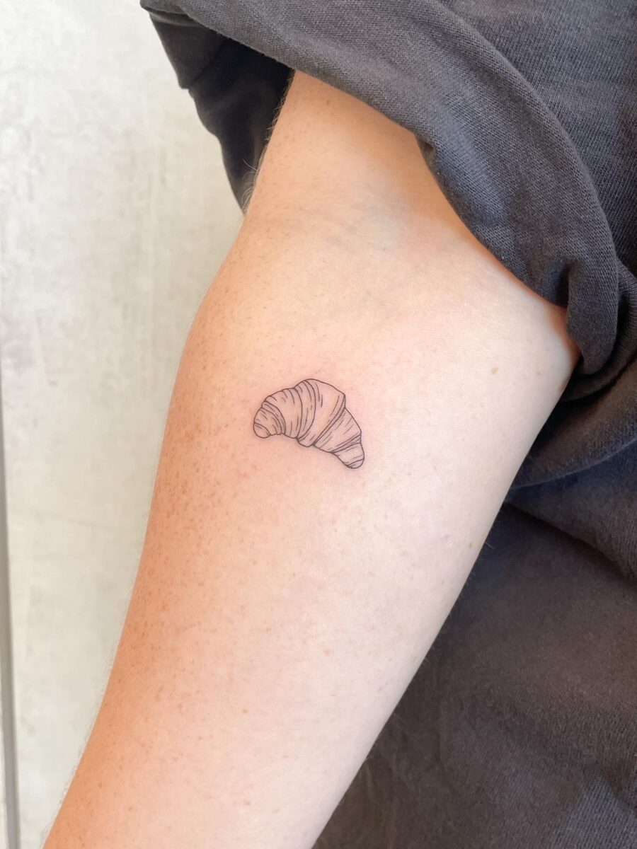 Delicate croissant tattoo on the forearm Tattoo on skin