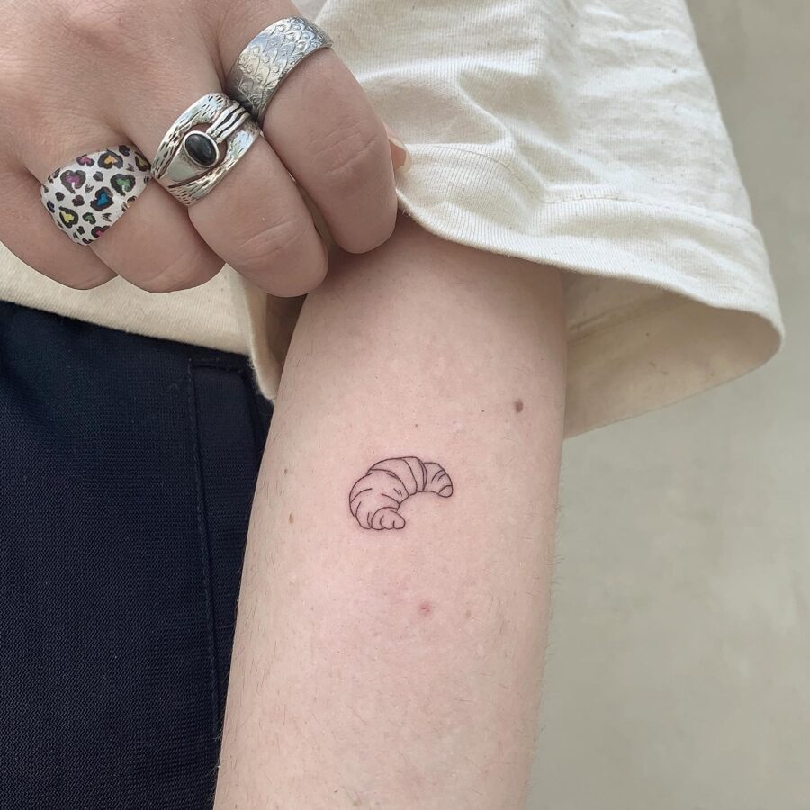 Minimalist Croissant Tattoo on Delicate Skin Tattoo on skin