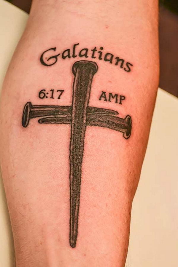 Cool cross tattoo on a guy's arm Tattoo on skin