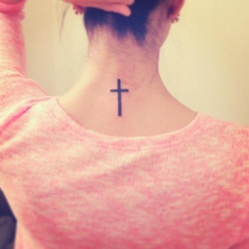 Simple black cross tattoo on girl's neck Tattoo on skin