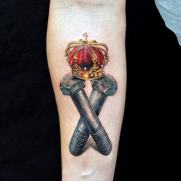 Crossed Bolts with Regal Coronet Tattoo on skin