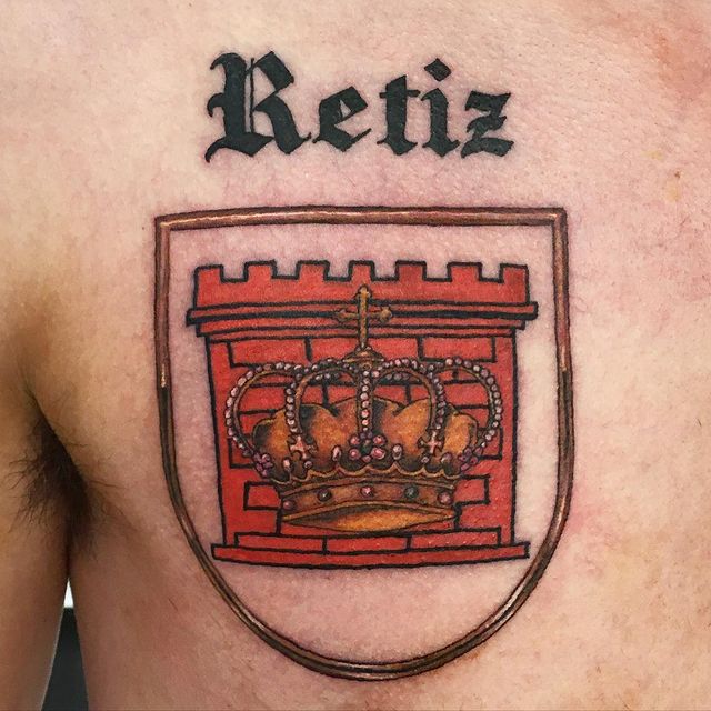 Crown with Coat of Arms Ink Tattoo on skin