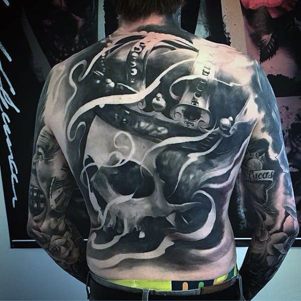 Eerie Crowned Skeleton Full Back Tattoo Tattoo on skin