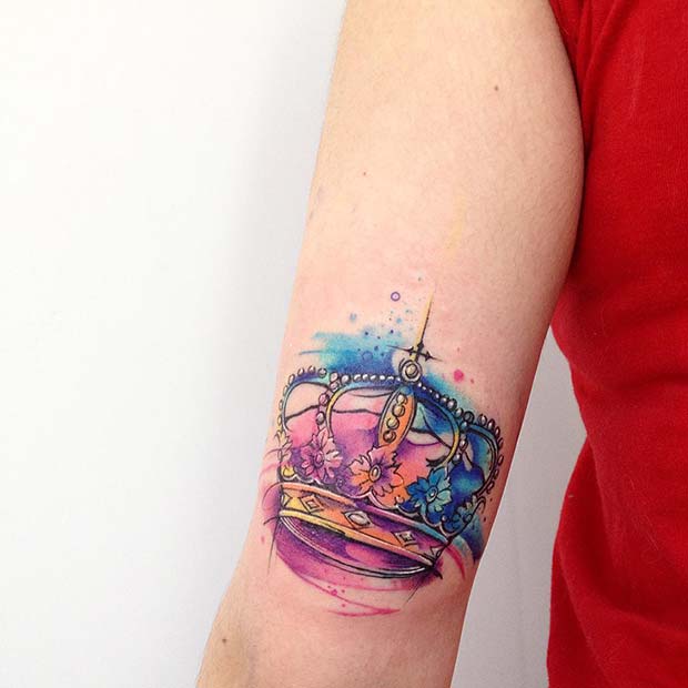 Pink and Blue Upper Elbow Art Tattoo on skin