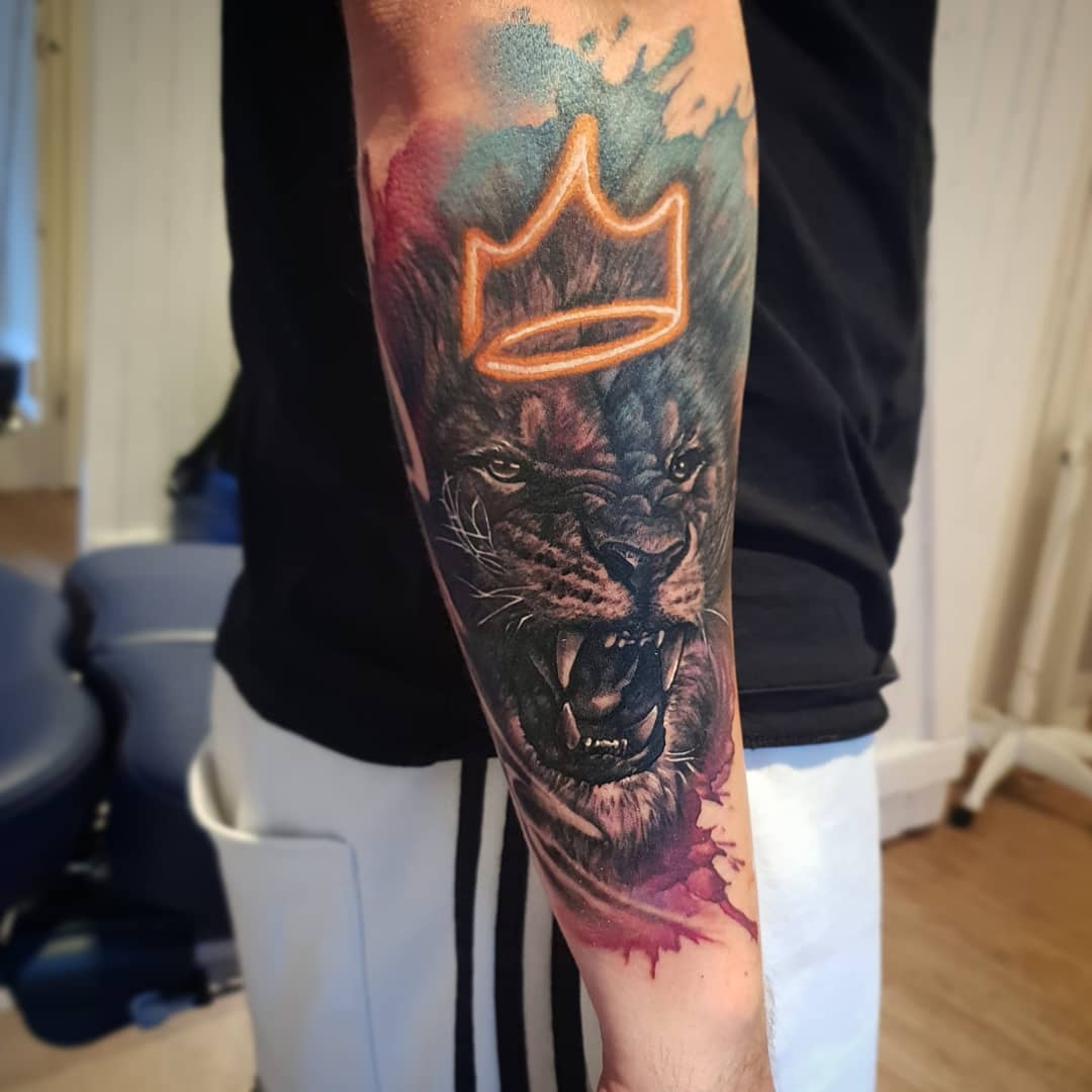 Vivid, Crowned Lion Tattoo Sleeve Tattoo on skin