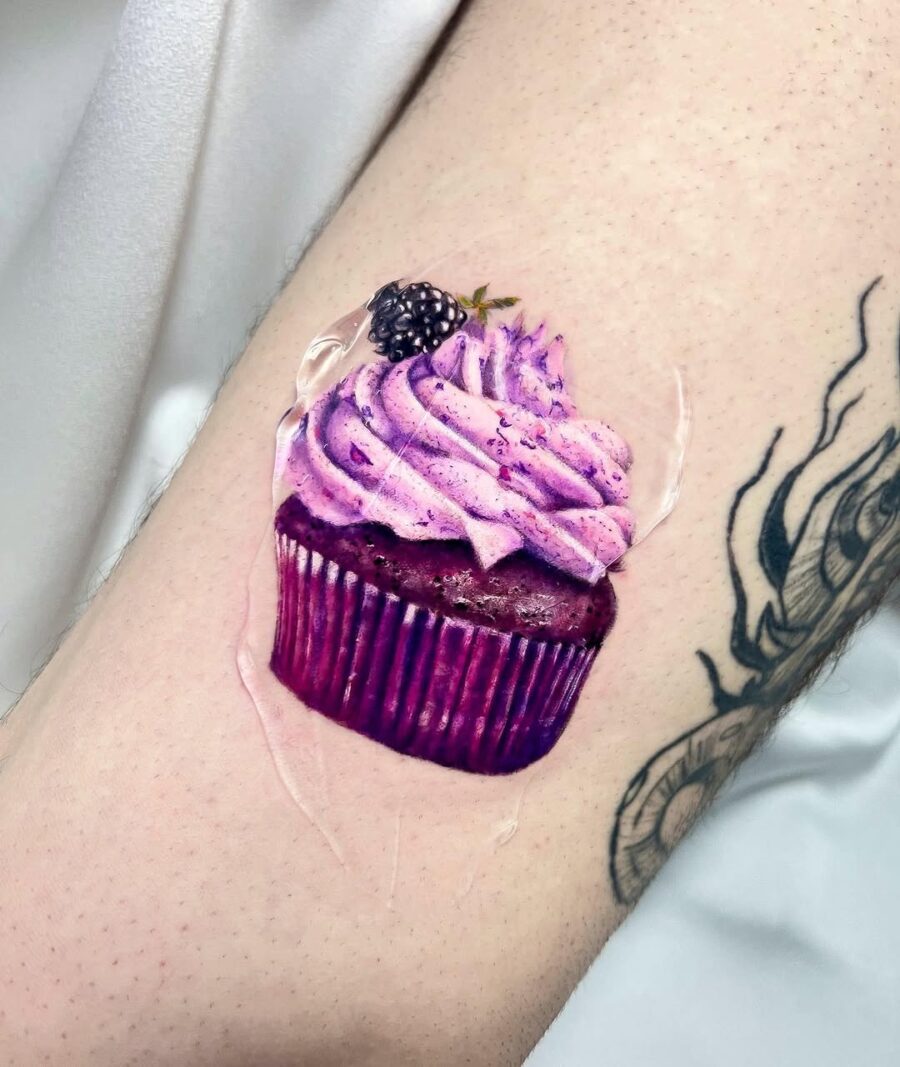 A vibrant cupcake tattoo showcasing rich details Tattoo on skin