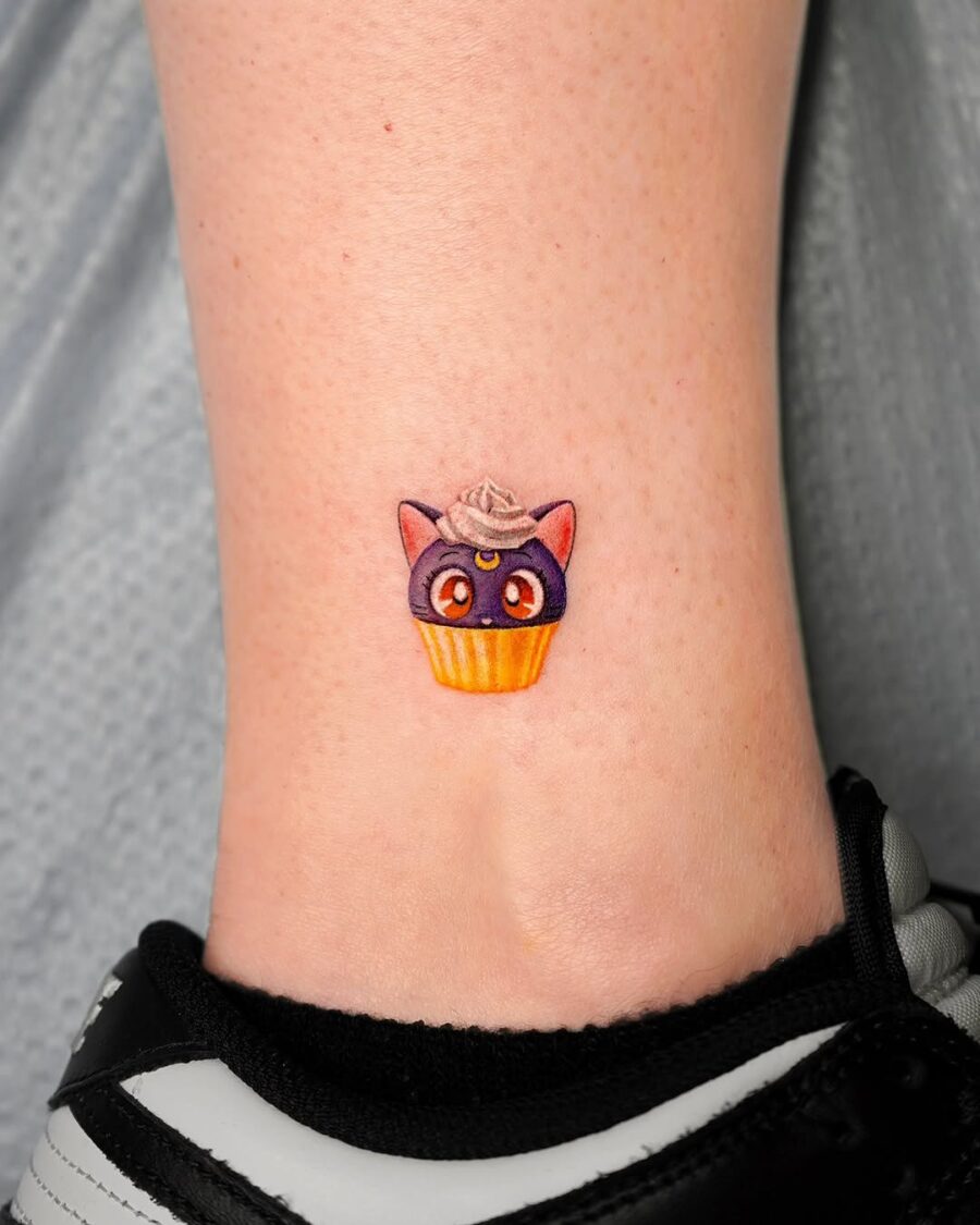 Adorable cupcake cat tattoo on ankle Tattoo on skin