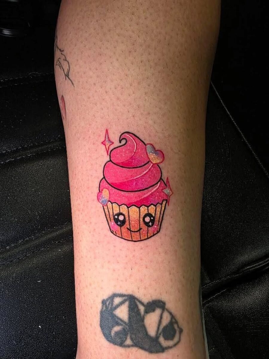 Adorable cupcake tattoo with sparkling details Tattoo on skin