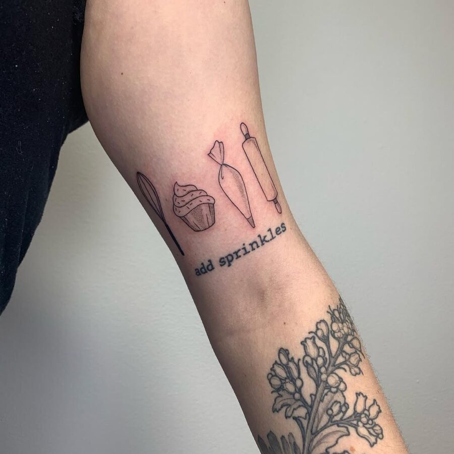 Charming cupcake tattoo celebrates baking joy Tattoo on skin