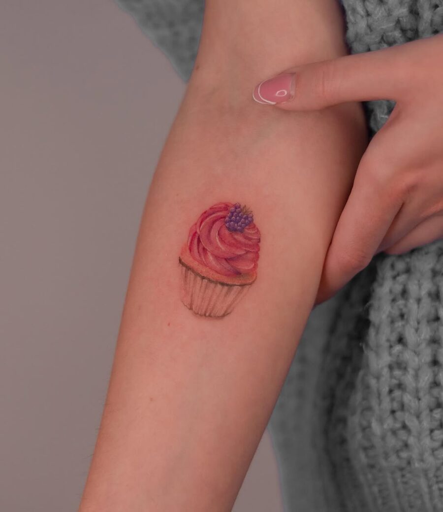 Charming cupcake tattoo with vibrant colors Tattoo on skin