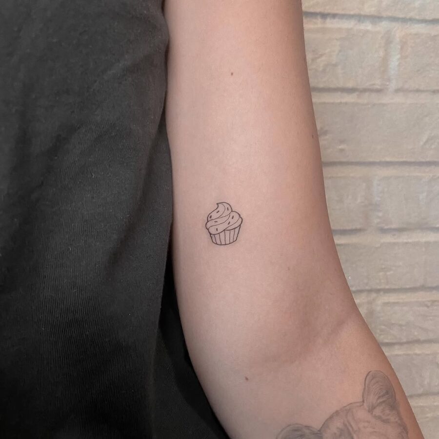 Charming tiny cupcake tattoo on the arm cupcake tattoos