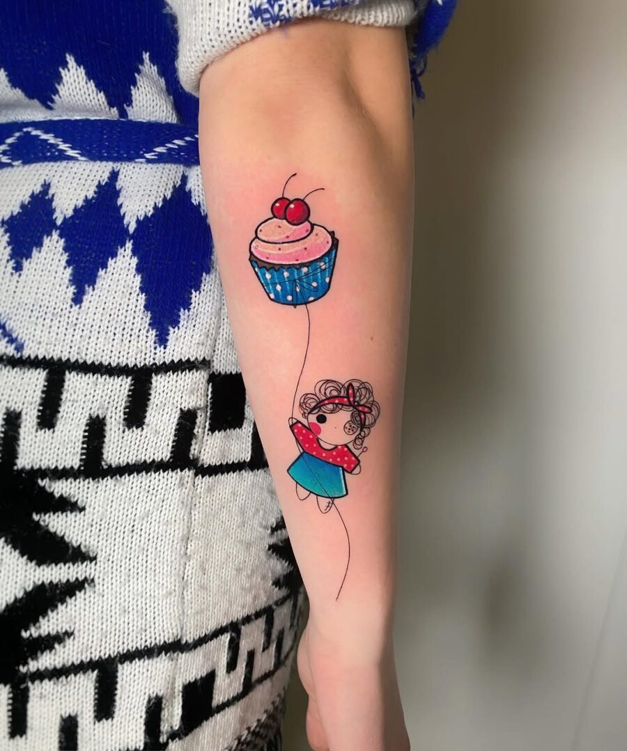 Cute cupcake tattoo with whimsical girl illustration Tattoo on skin