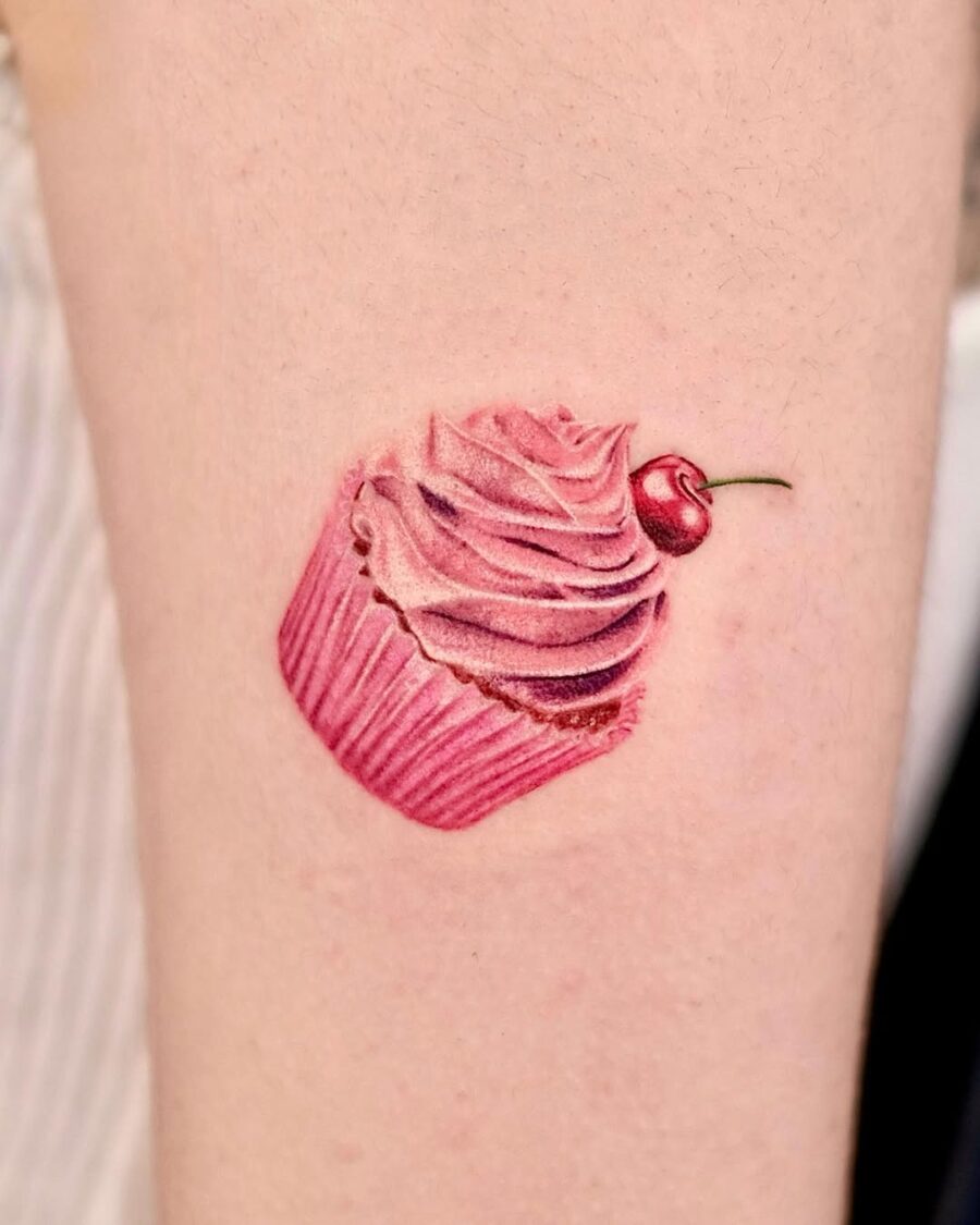 Deliciously vibrant pink cupcake tattoo design Tattoo on skin