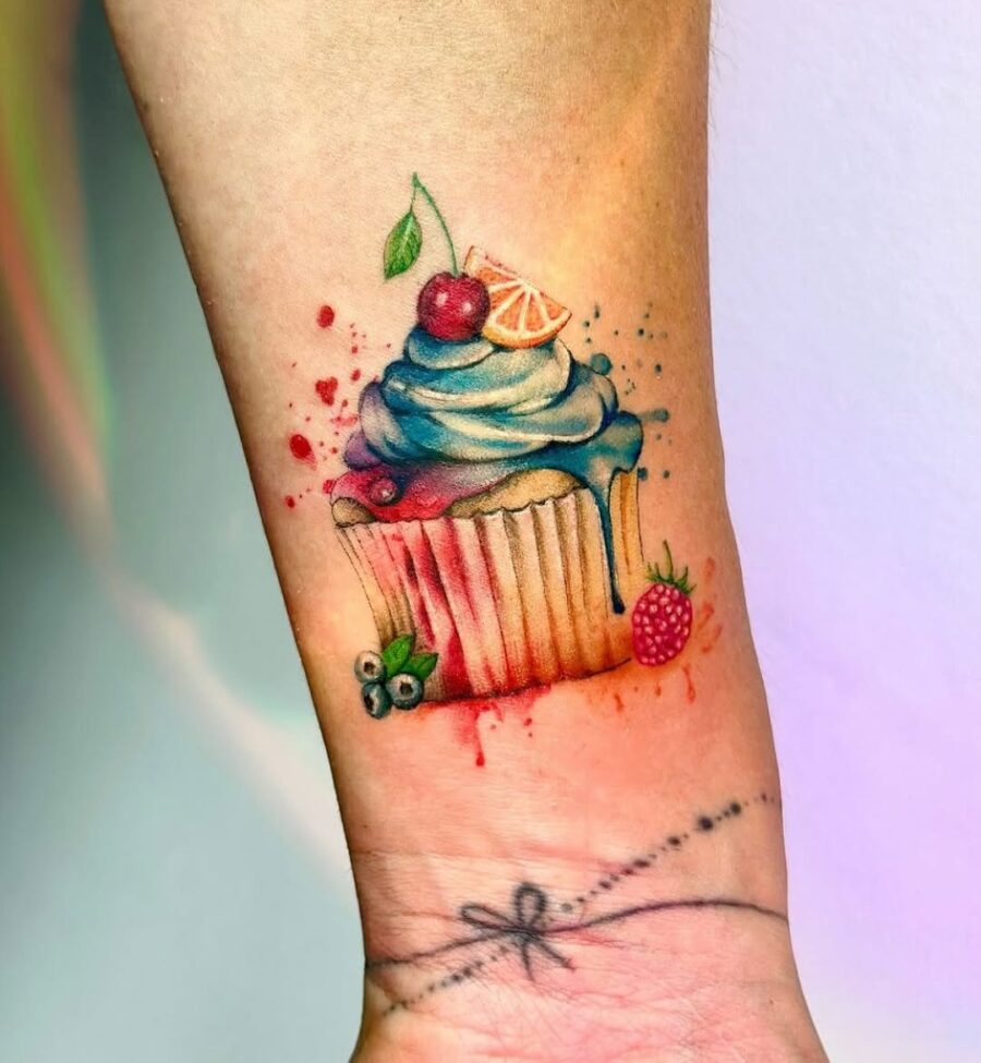 Lively cupcake tattoo with vibrant colors and details Tattoo on skin