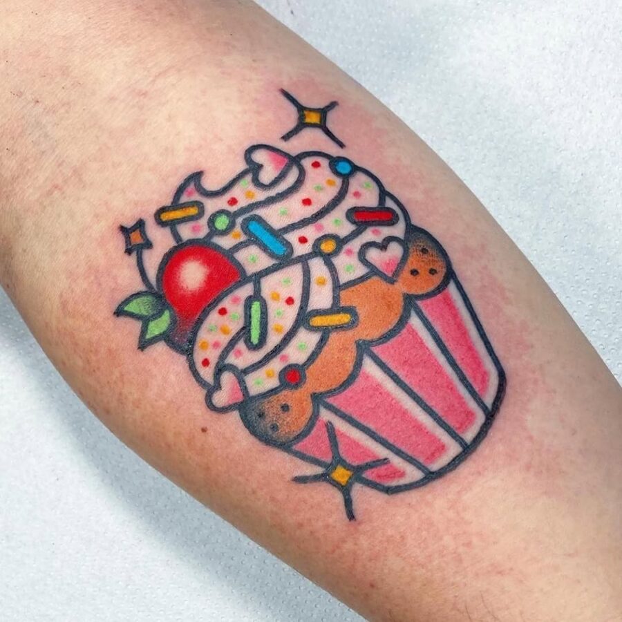 Vibrant cupake tattoo bursting with sweetness Tattoo on skin