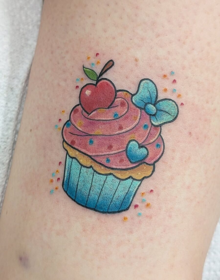 Vibrant cupcake tattoo with playful details Tattoo on skin