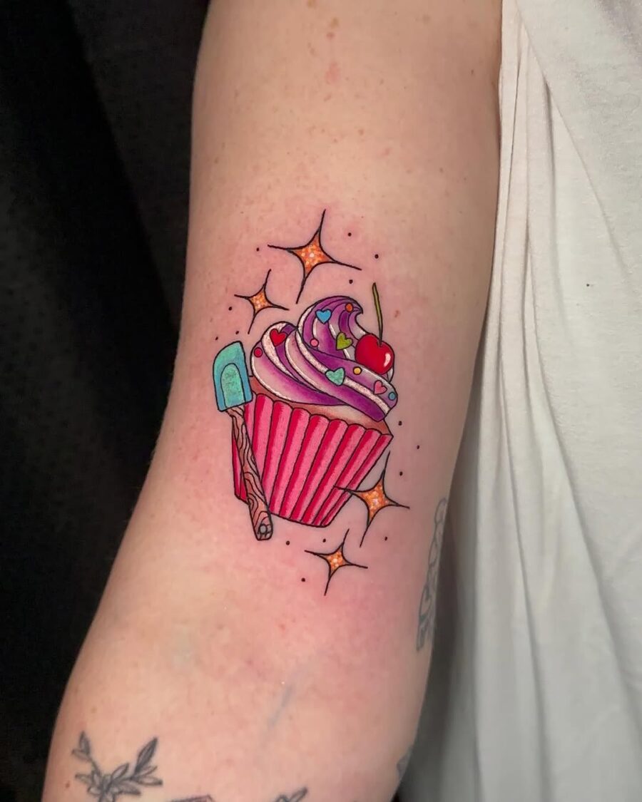 Vibrant cupcake tattoo with playful details Tattoo on skin