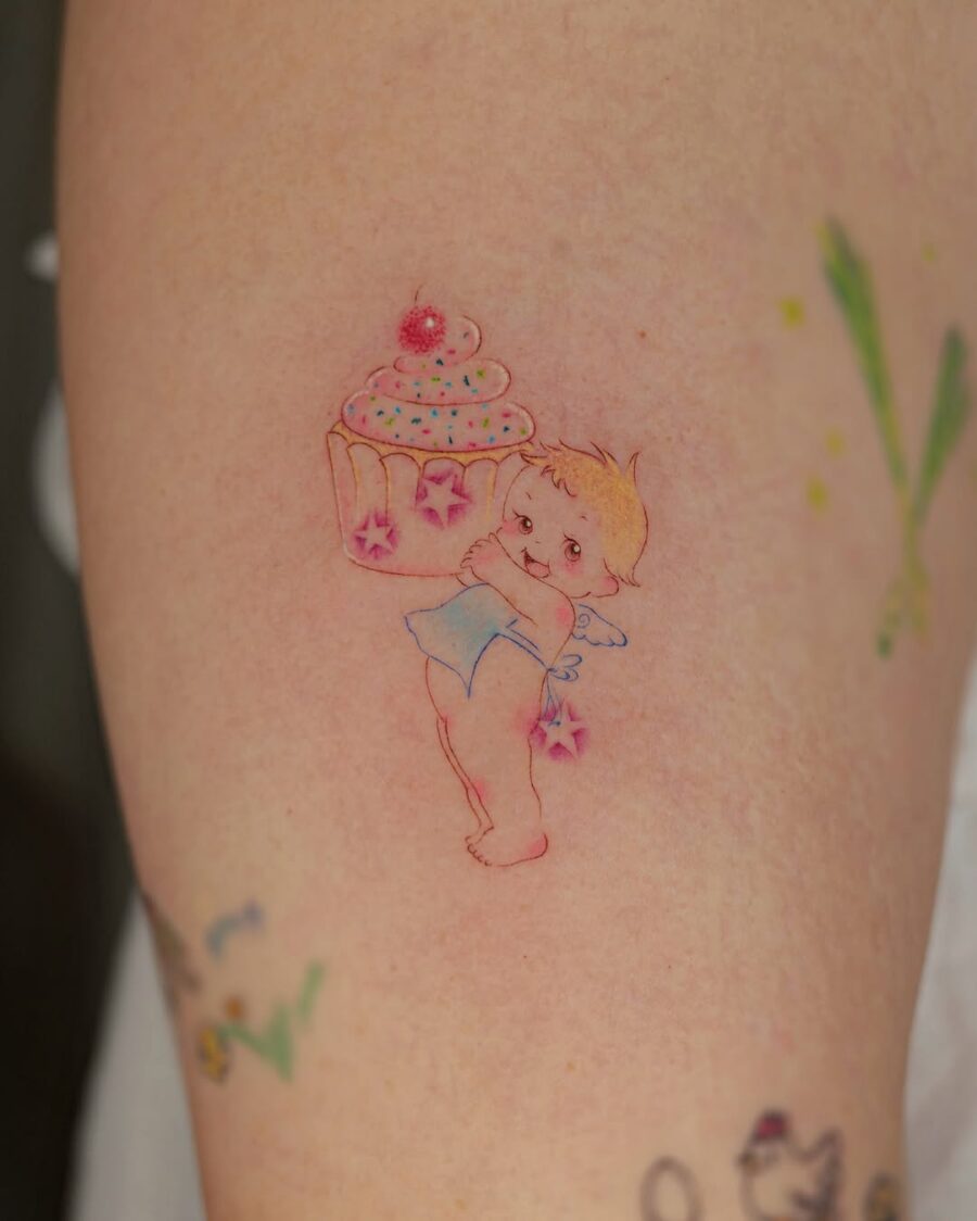 Whimsical angelic cupcake tattoo design Tattoo on skin