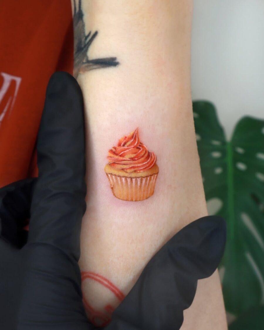 Whimsical cupcake tattoo perfect for dessert lovers Tattoo on skin