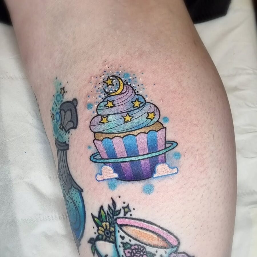 Whimsical cupcake tattoo with celestial elements Tattoo on skin