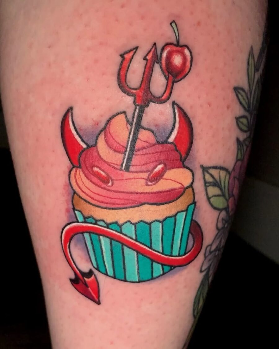 Whimsical devil-themed cupcake tattoo design Tattoo on skin