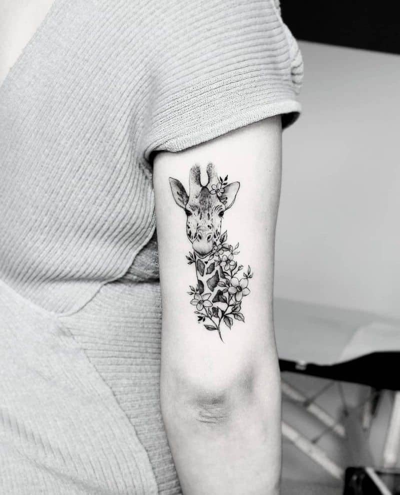 Giraffe Smelling Flower Tattoo Tattoo on skin