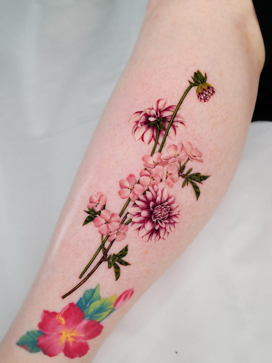Captivating floral dahlia tattoo design on arm Tattoo on skin