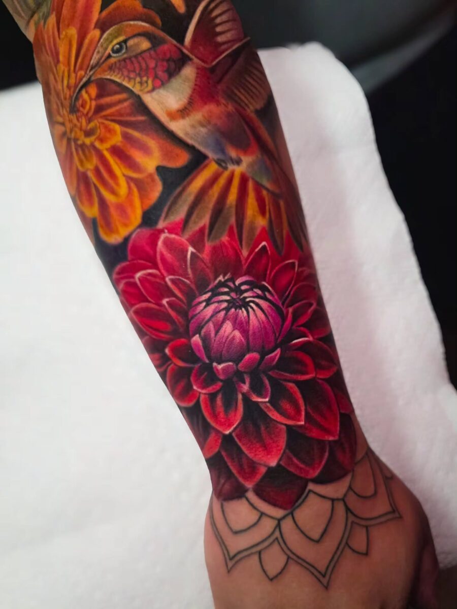 Colorful dahlia and hummingbird tattoo design. Tattoo on skin