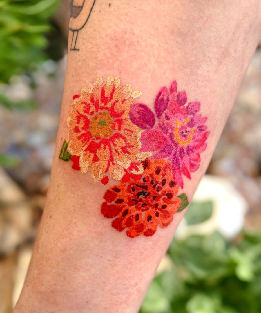 Colorful Dahlia Tattoo with Floral Vibes Tattoo on skin
