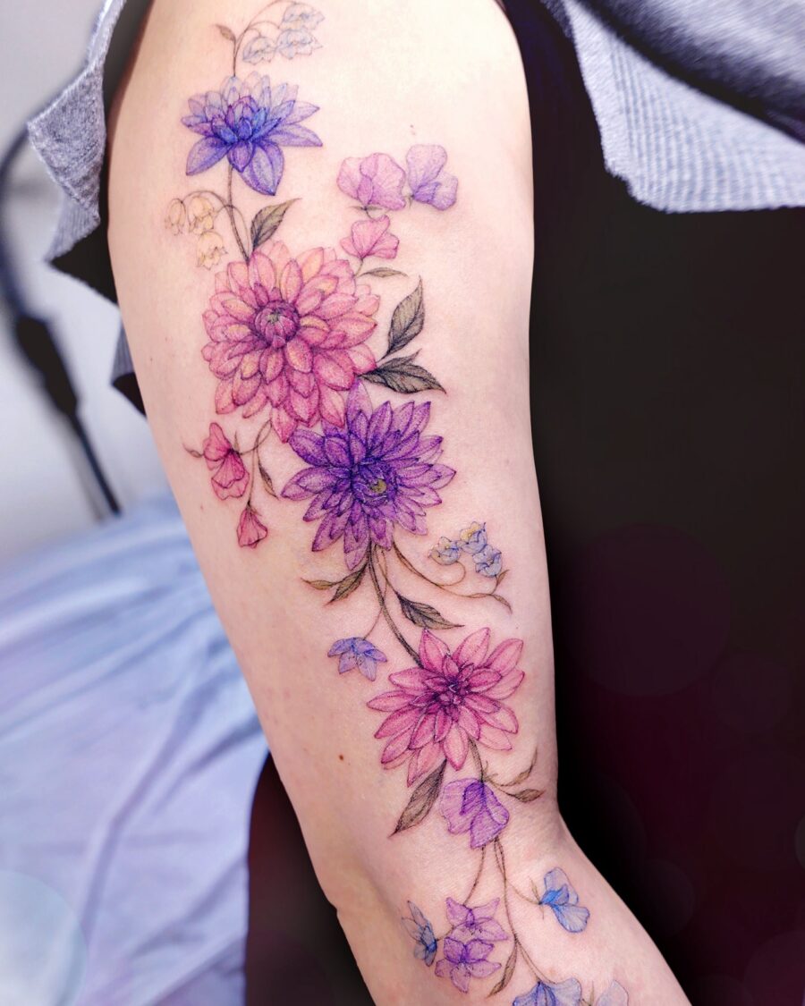 Elegant dahlia tattoo design with soft colors dahlia tattoos