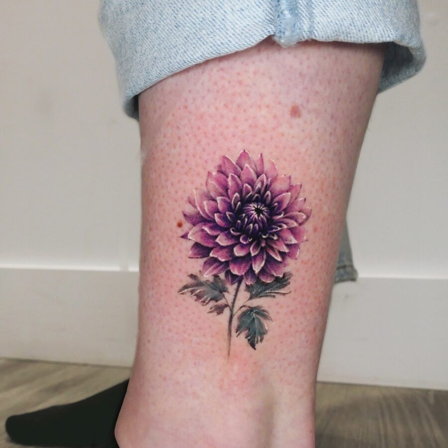 Elegant purple dahlia tattoo on the leg Tattoo on skin