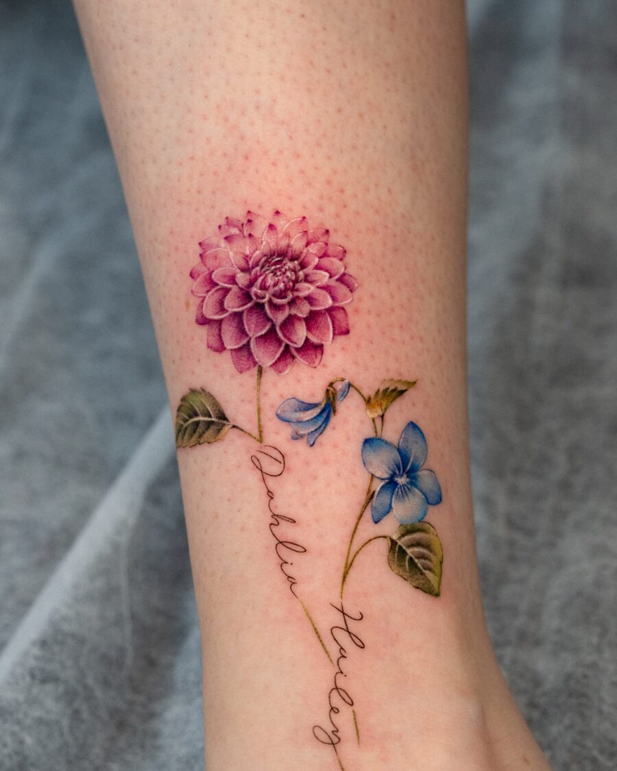 Vibrant dahlia and blue flower tattoo design Tattoo on skin