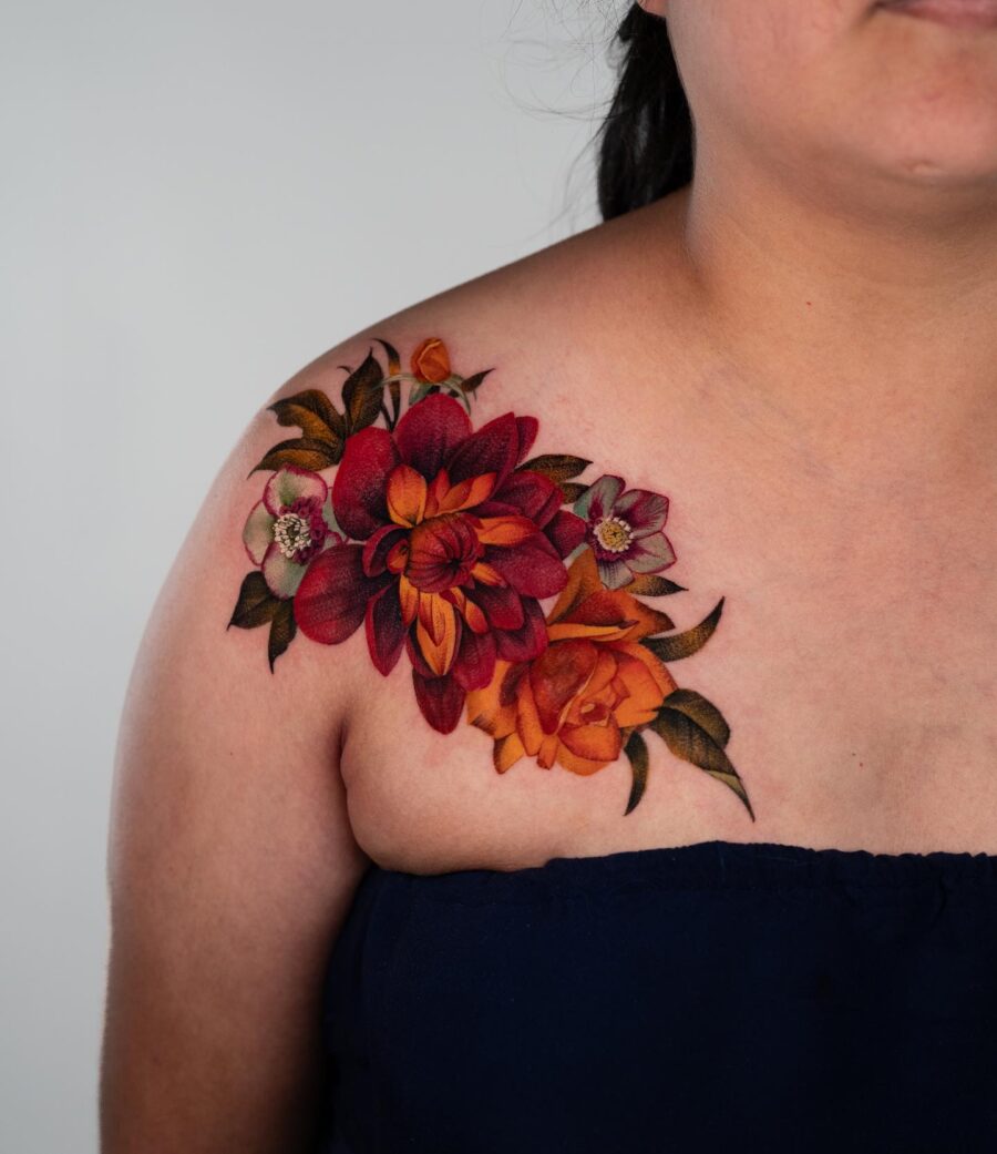 Vibrant dahlia tattoo adorned on the shoulder Tattoo on skin