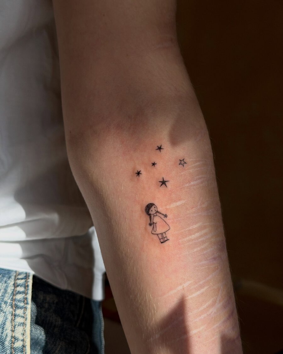 Charming Illustration of a Girl Among Stars Tattoo on skin