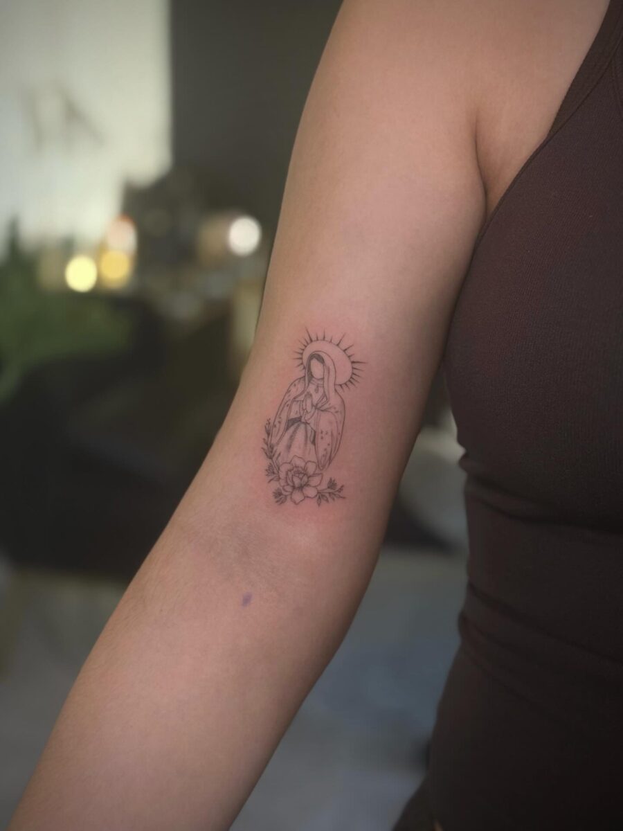 Elegant Dainty Tattoo of a Female Figure Tattoo on skin