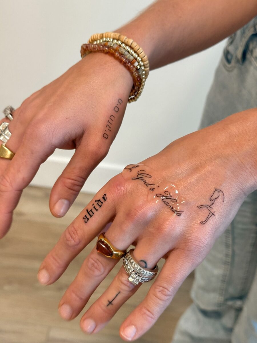 Elegant dainty tattoos adorn stylish hands Tattoo on skin