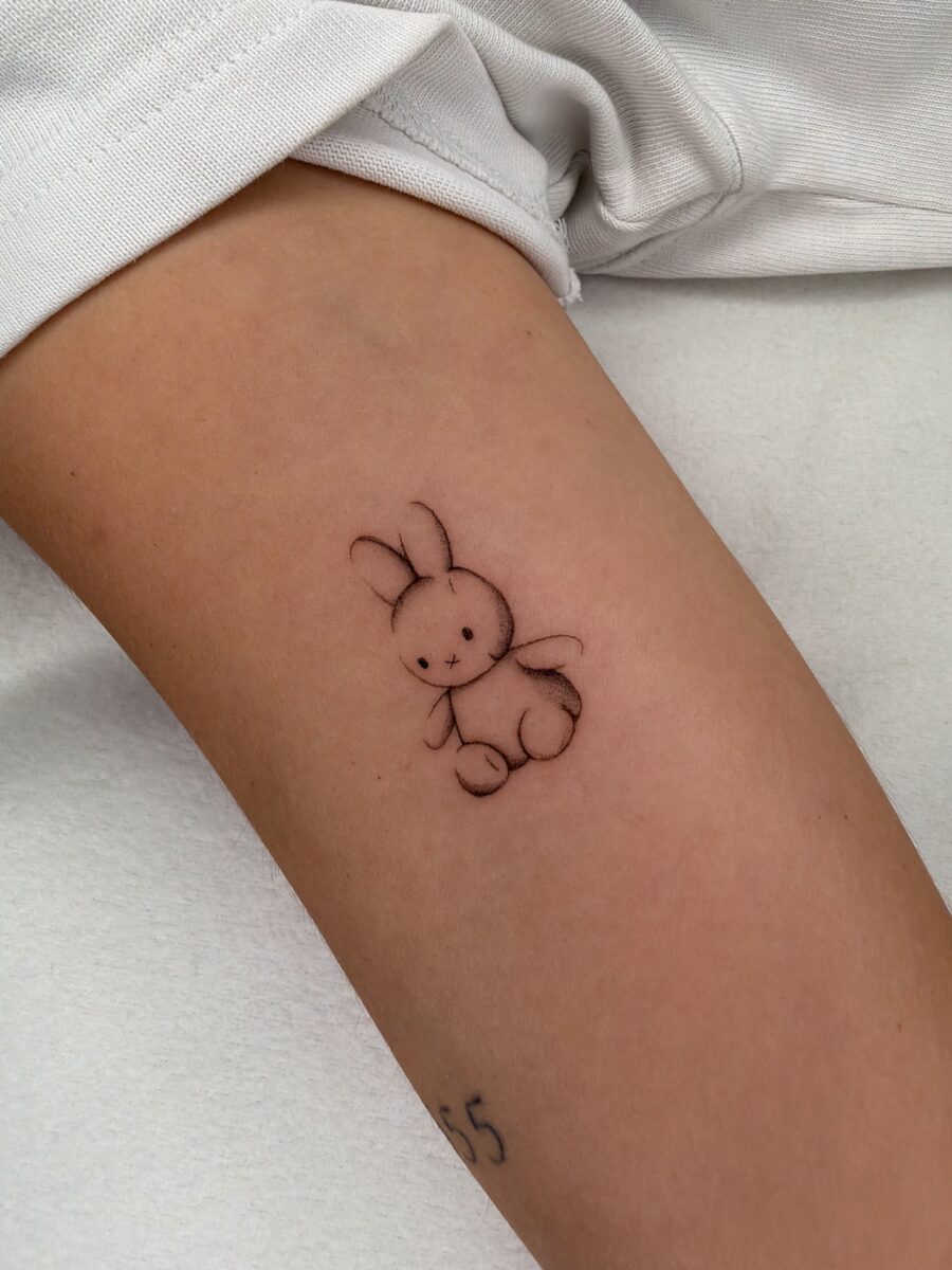 Whimsical bunny tattoo for playful vibes Tattoo on skin