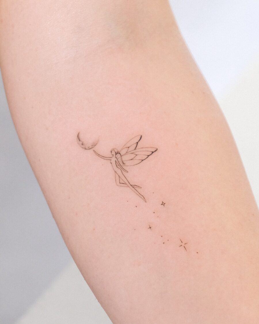 Whimsical fairy with moon and stars tattoo Tattoo on skin