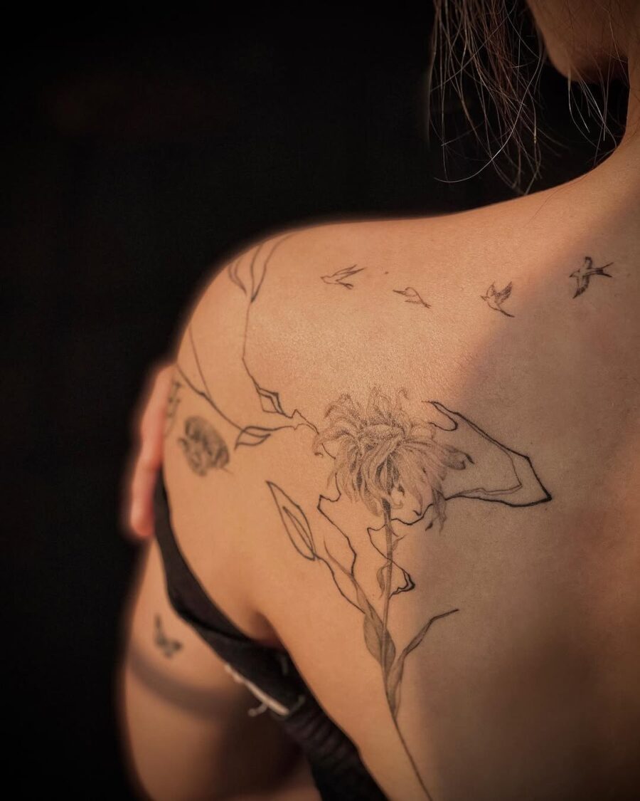 Artistic dead flower tattoo with delicate details Tattoo on skin