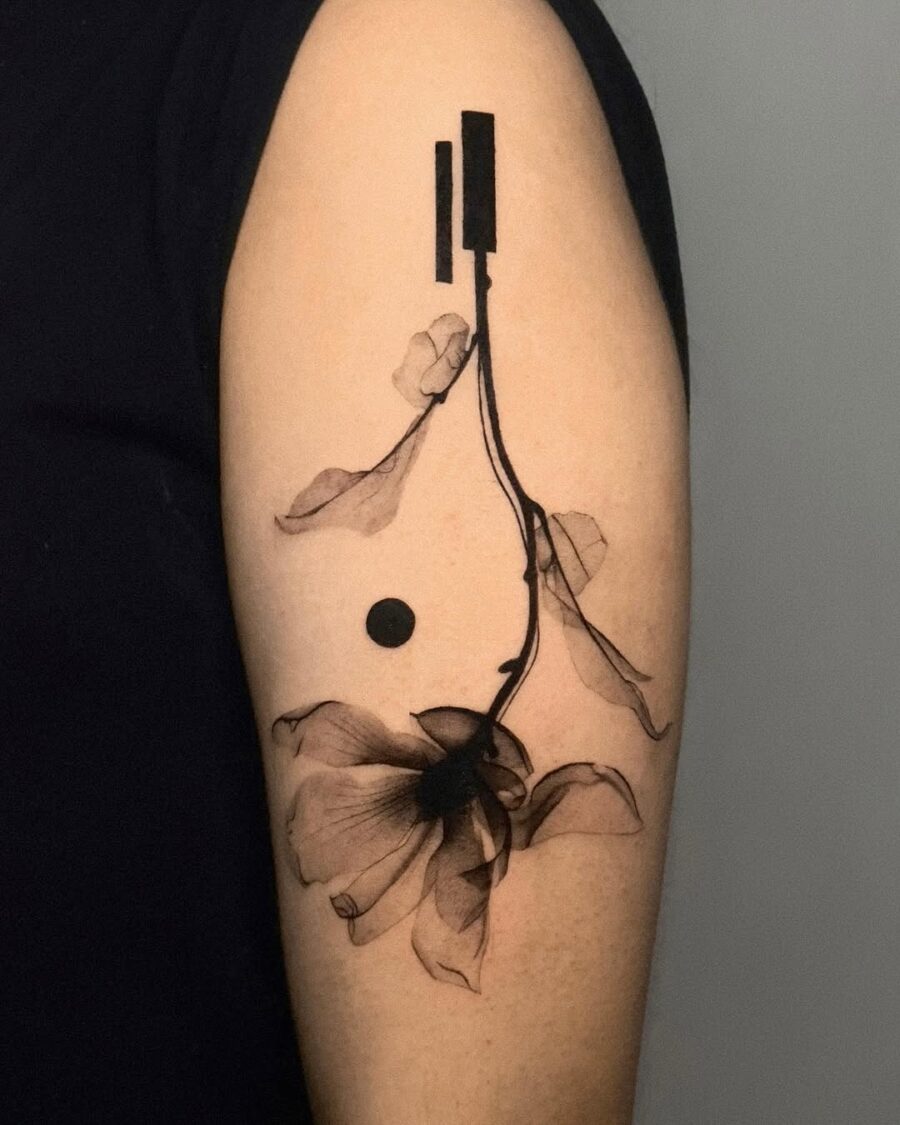 Artistic interpretation of death through floral ink Tattoo on skin