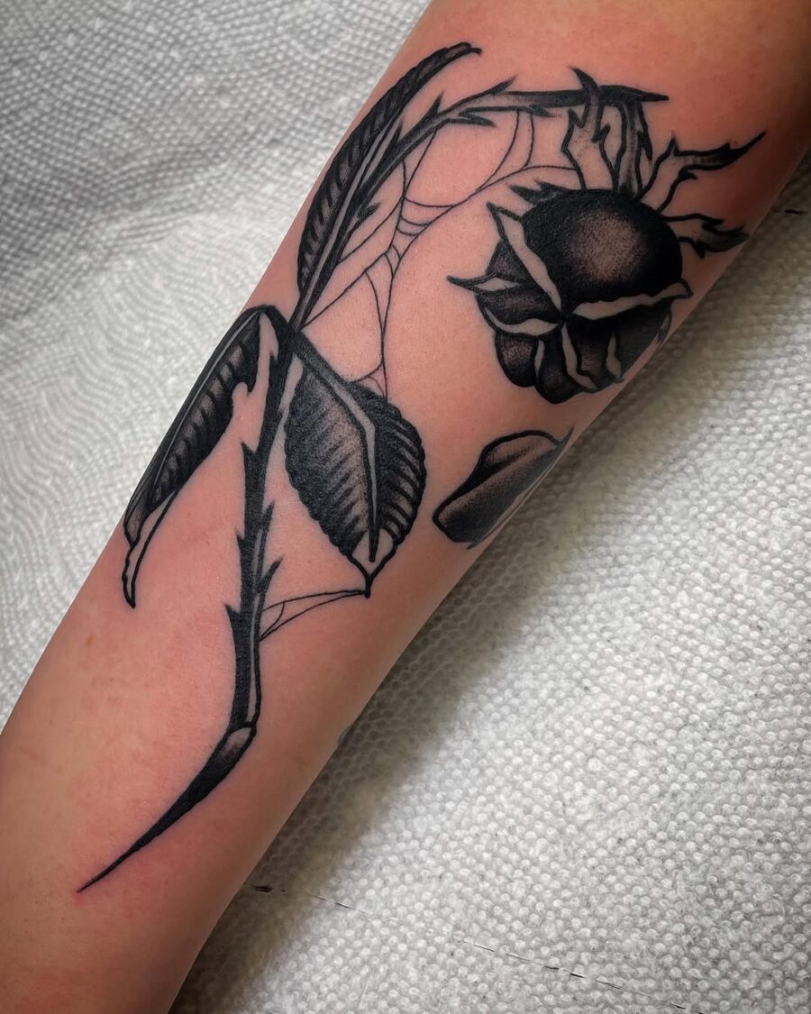 Elegant black ink dead flower tattoo design Tattoo on skin