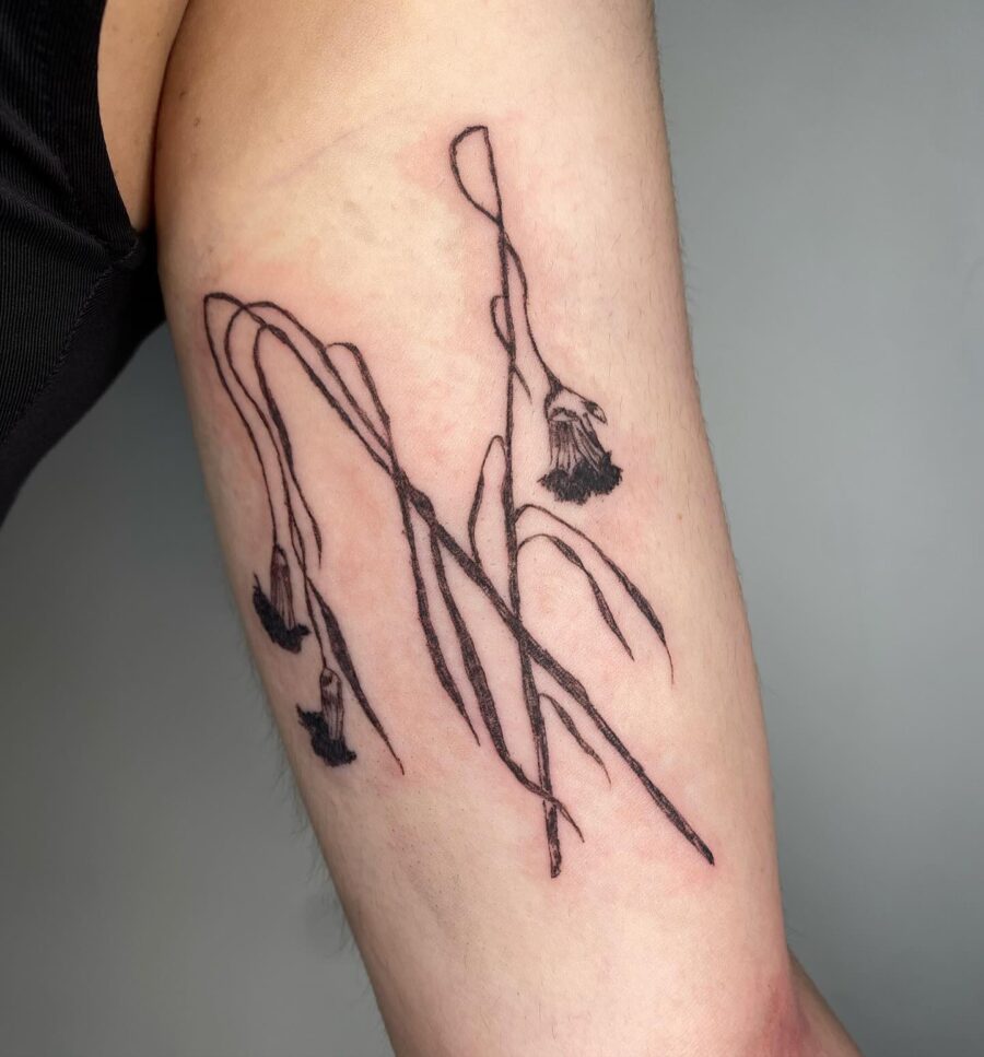 Elegant dead flower tattoo with fine lines Tattoo on skin